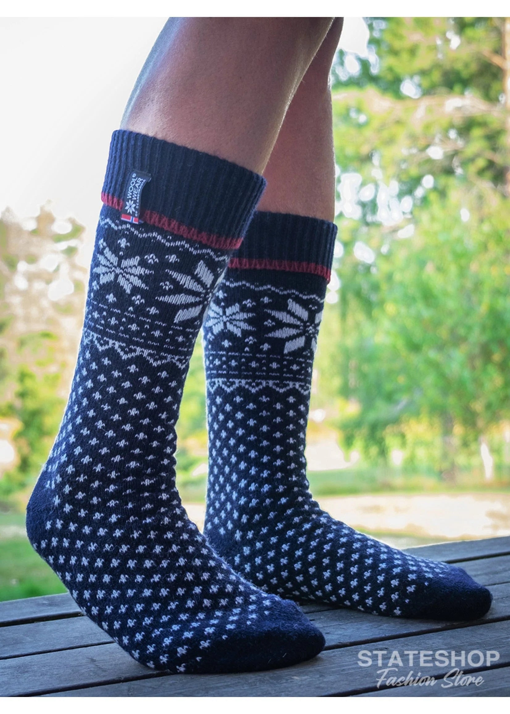 Norfinde Long Norwegian wool socks with a Nordic design, dark blue